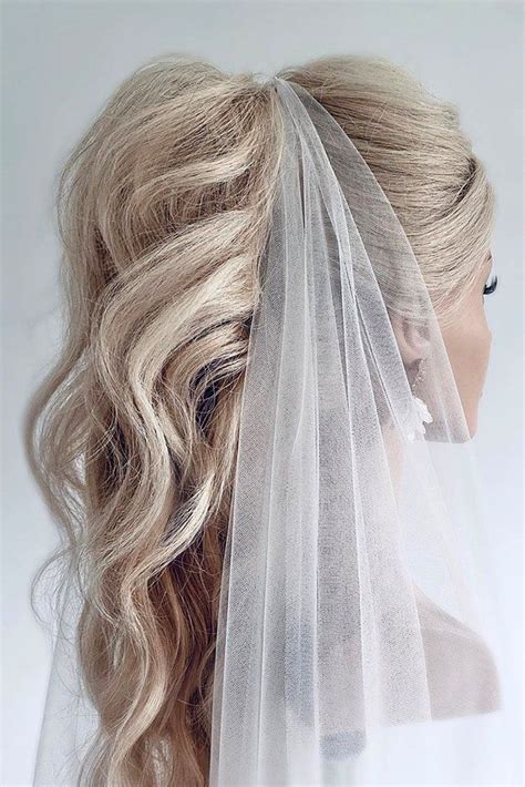Ponytail and veil. . Bridal ponytail with veil